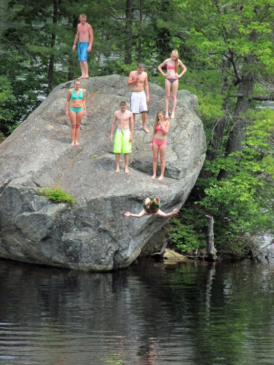 This is not safe, ever.  But as long as there are teenagers, they will be doing back flips off the rock.  However, when the water level is too low, injuries happen.  