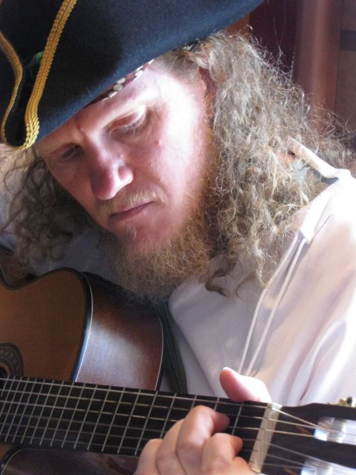 To honor Naomi's soon to be cruising adventure on the high seas, I'm sharing a photograph from a cruise we took together.  One wonderful member of our group, from Australia, dressed as a pirate the entire trip.  He was a truly wonderful, and musically talented, travel companion.