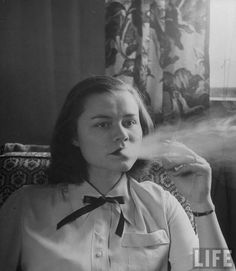 LIFE magazine photograph of a smoking gym teacher, at least this is the the teachers lounge.