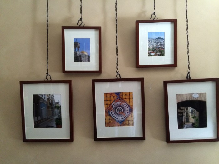 Photo prints from travels. Hanger system from Pottery Barn.